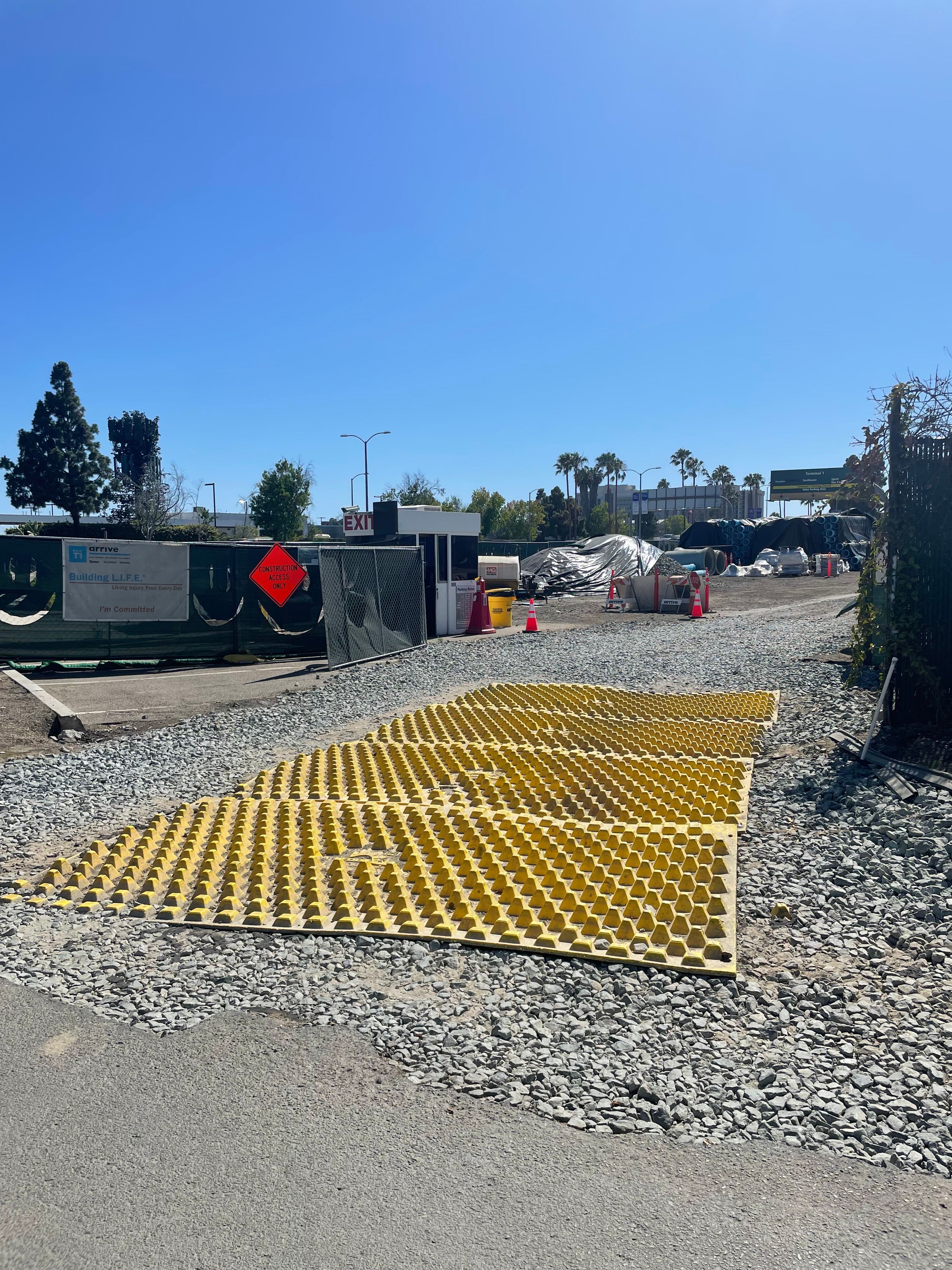 Construction Track Out Controls San Diego New T1 Improvement Project Construction Entrance FODS Reusable Trackout Control Mats Two Lane Construction Entrance Exit TC-1 Installed Over Stone