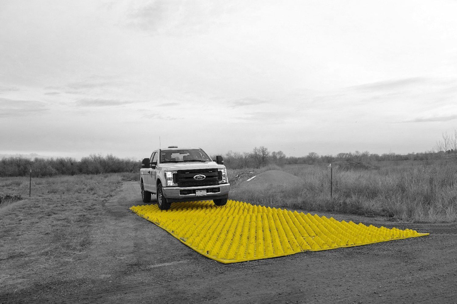 Contractor Using FODS Trackout Control Mats As Reusable Construction Entrance BMP