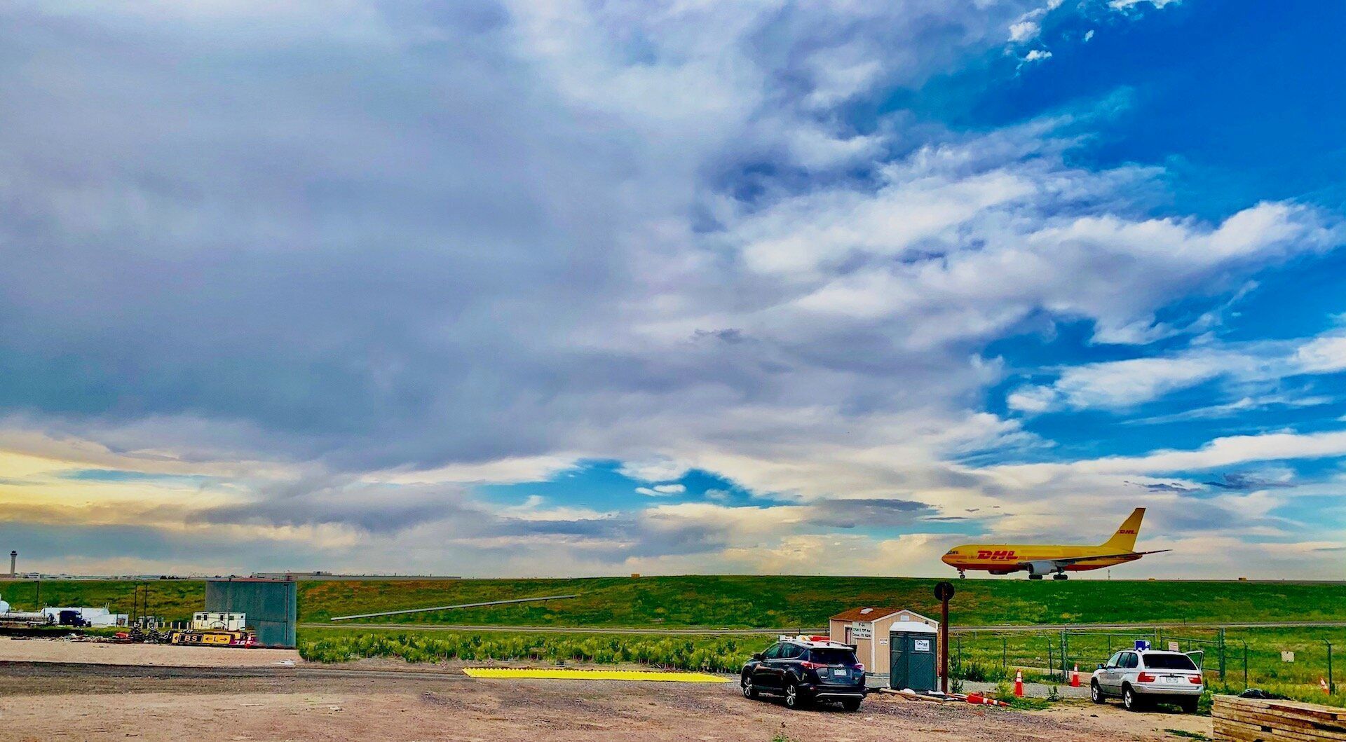FOD Prevention System Trackout Control System Construction Entrance Construction Exit TC-1 Installed At DIA Access Road With DHL Plane In Background FODS