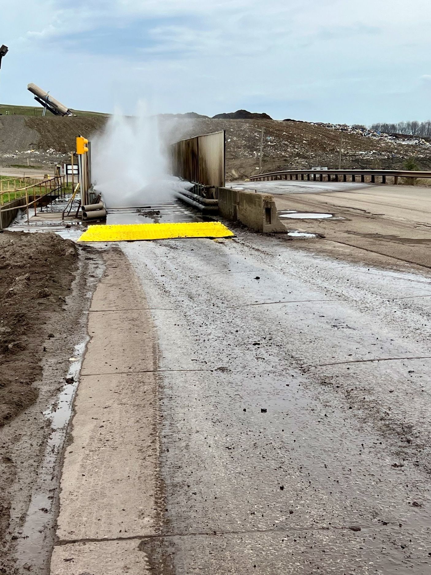 FODS Construction Entrance Exit TC-1 Trackout Control System Installed With Wheel Wash System On Paved Roadway