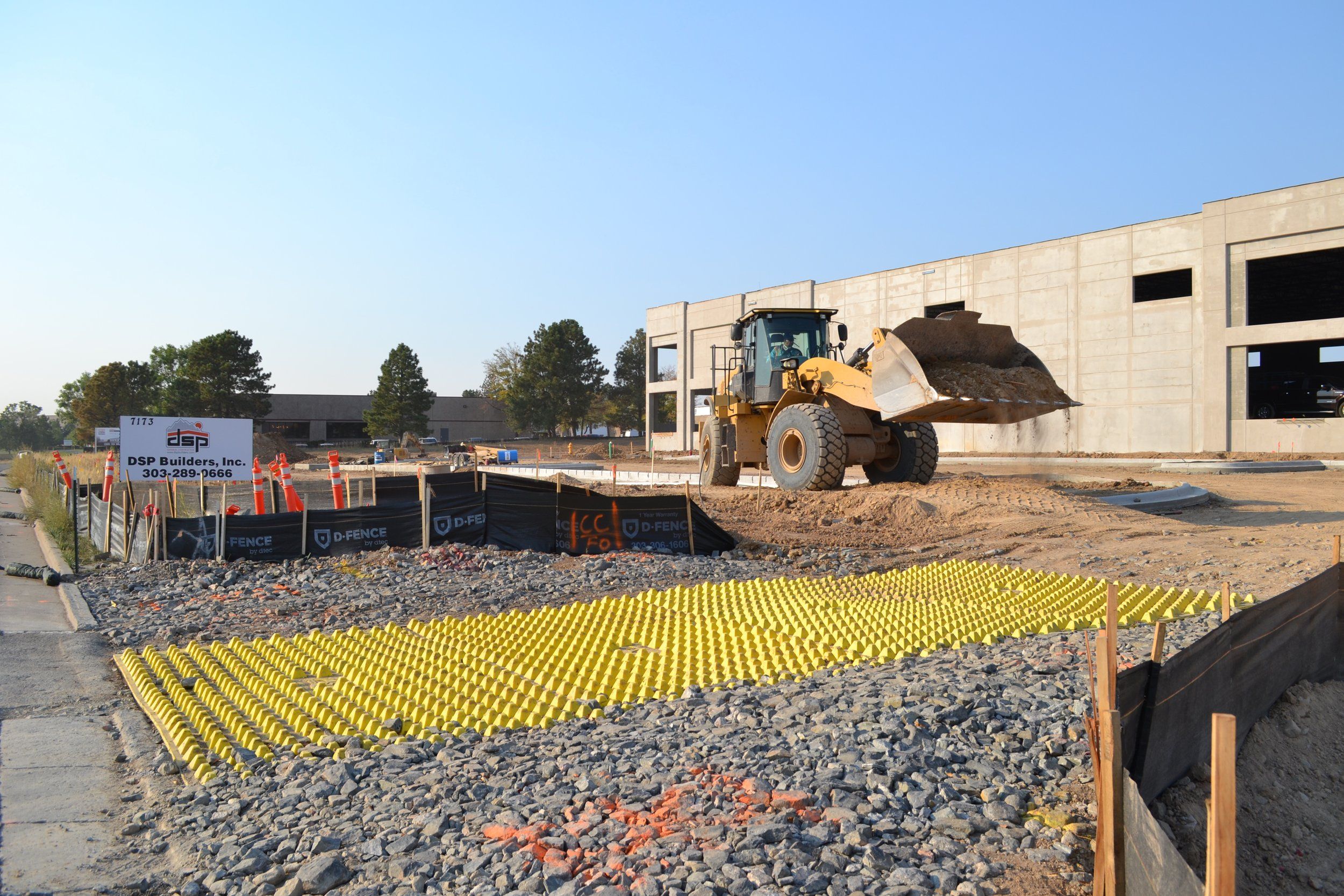 FODS Trackout Control Mats Installed At Construction Entrance On Jobsite In Colorado With Frontend Loader
