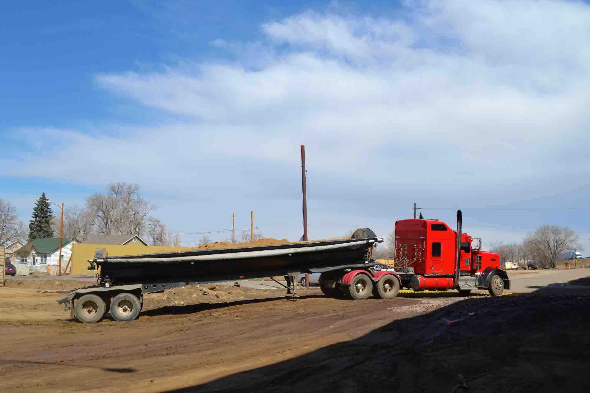 Red Side Dumper Central 70 Expansion Construction Entrance On Central 70 Project FODS Trackout Control Mats Construction Entrance Construction Exit Vehicle Tracking Controls BMP