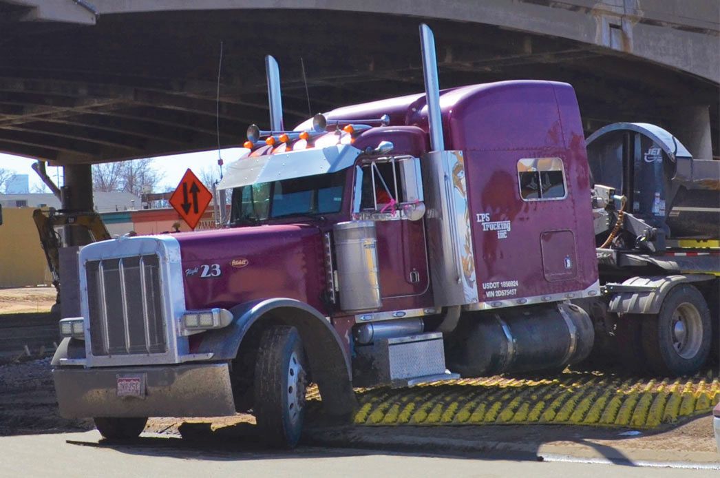 Semi Truck Exiting Central 70 Project Driving Over FODS Trackout Control Mats Construction Entrance Construction Exit Vehicle Tracking Controls BMP