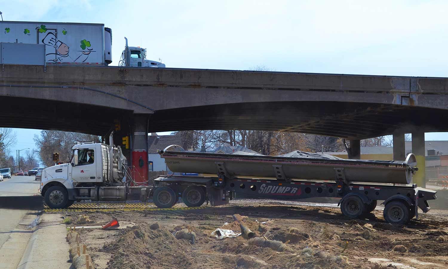 Side Dumper Exiting Through Construction Entrance On Central 70 Project FODS Trackout Control Mats Construction Entrance Construction Exit Vehicle Tracking Controls BMP