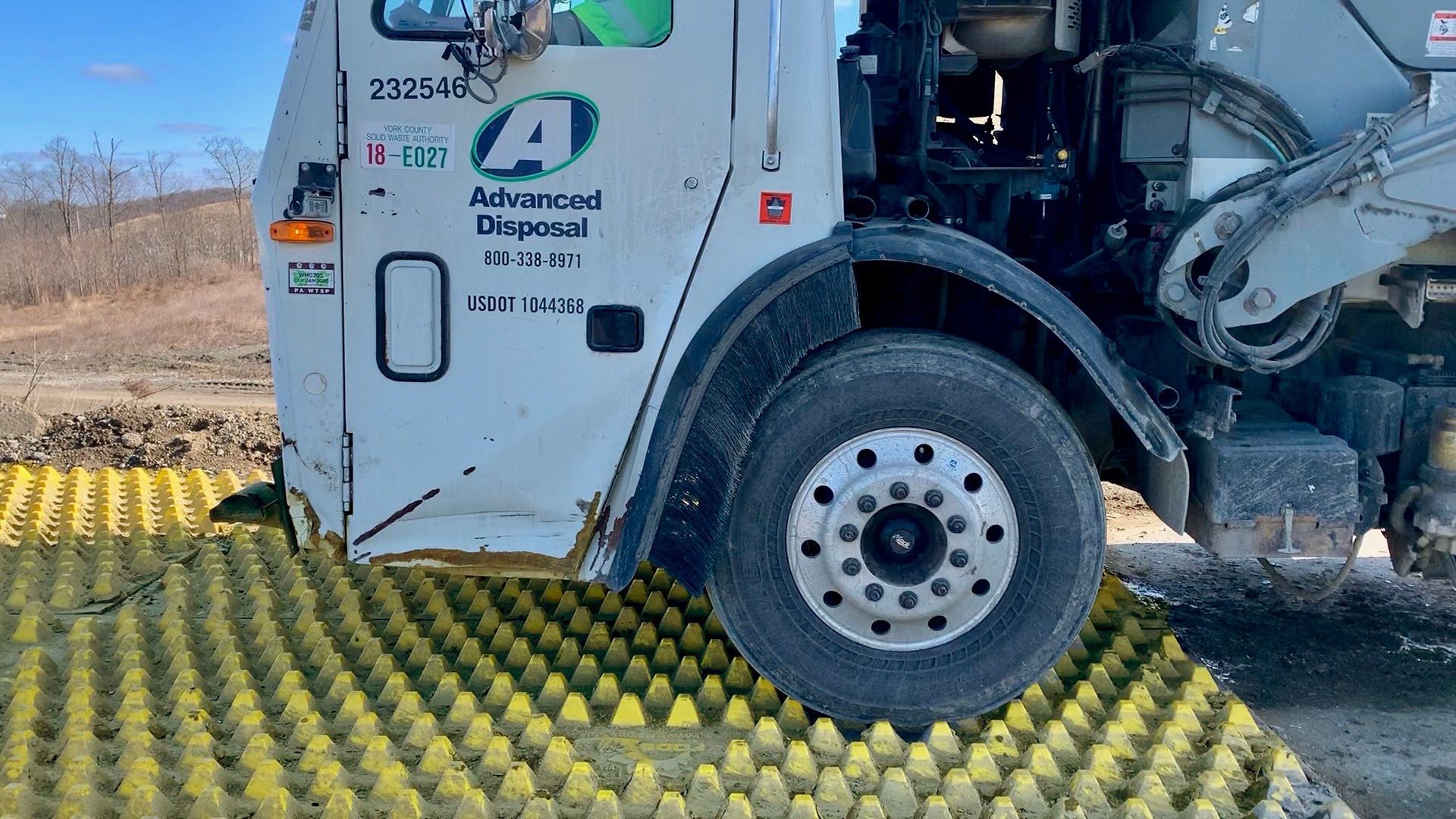Side View Of Truck Leaving Through Construction Exit At Cumberland Landfill