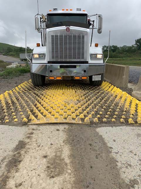 Truck Exiting Over FODS Trackout Control Mats At Cumberland County Landfill Reusable Construction Entrance Stabilized Construction Exit System